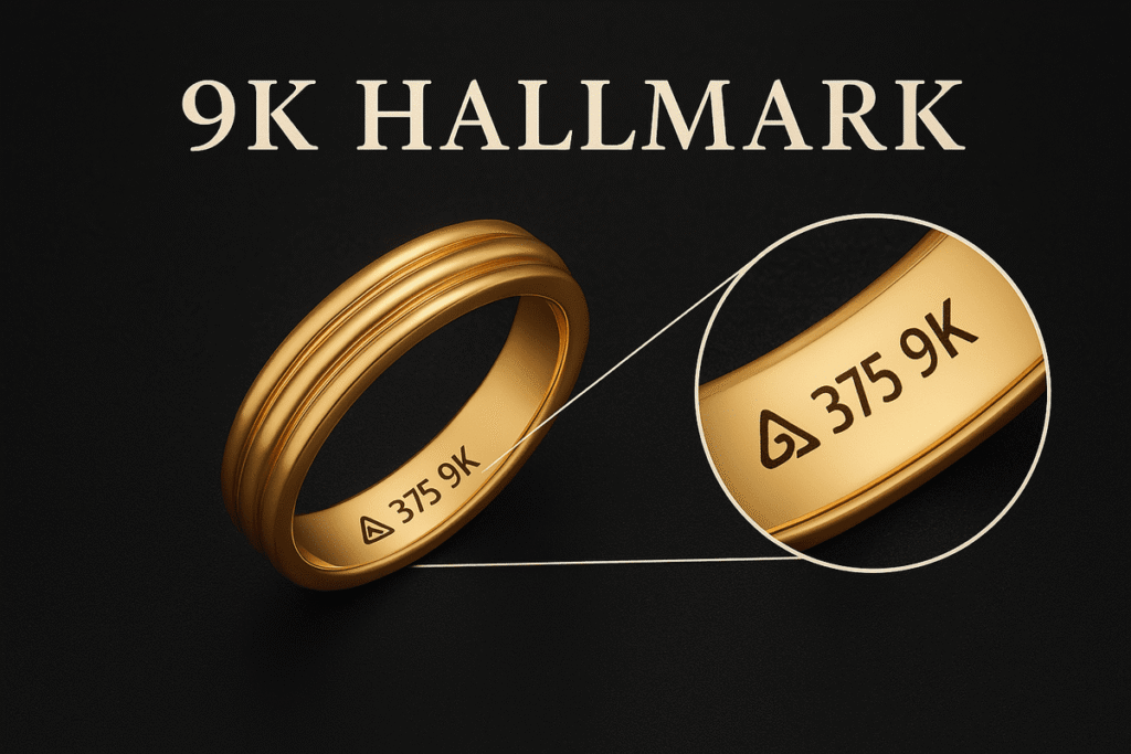 A close-up image of a golden ring engraved with ‘375 9K’ and a hallmark symbol, placed on a dark, textured background. A magnified circular inset highlights the engraving details.